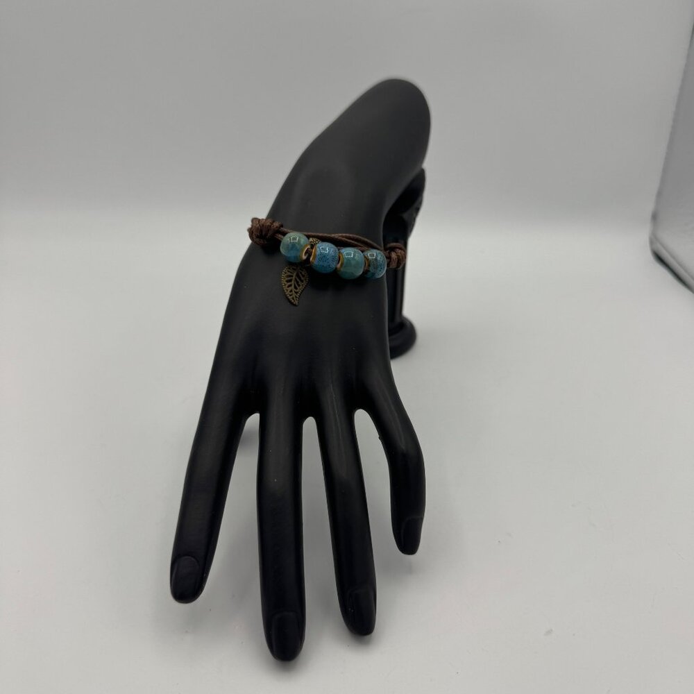 Knotted Leather Cord Bracelet With Turquoise Beads & Leaf Charm